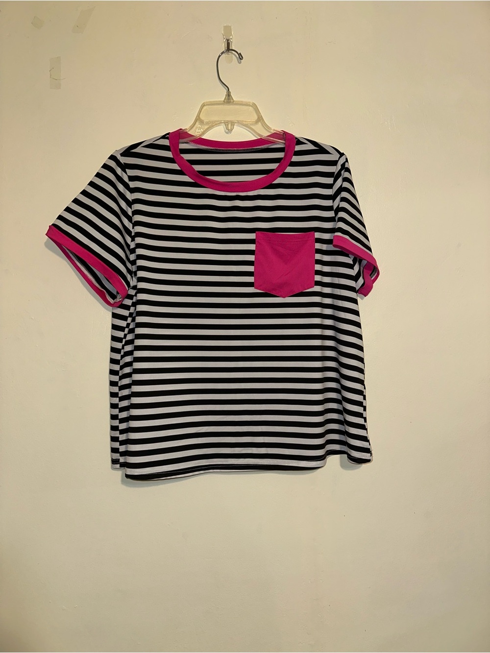 Striped top with hot pink pocket and sleeves tab